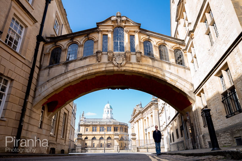 Photograph taken in Oxford during lockdown of Bridge of Sighs with teenage girl standing beneath