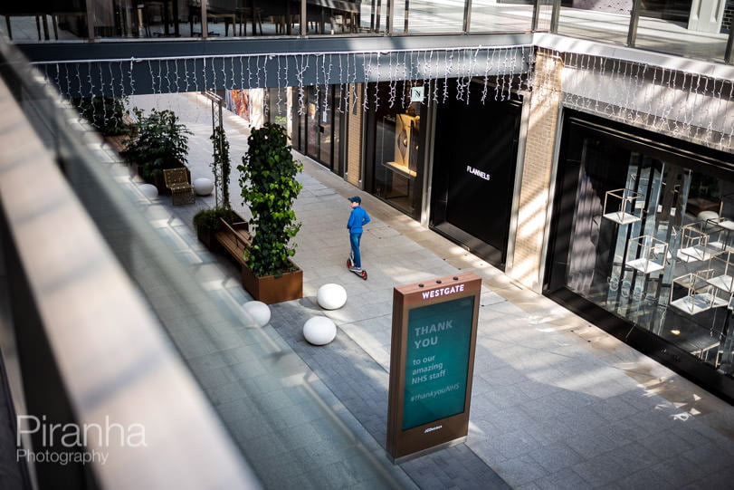 Teenager in empty Westgate shopping mall photographed in front of NHS sign