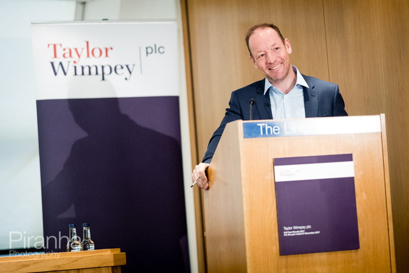 Photograph of FTSE 100 company Chief Executive speaking at results presentation in London