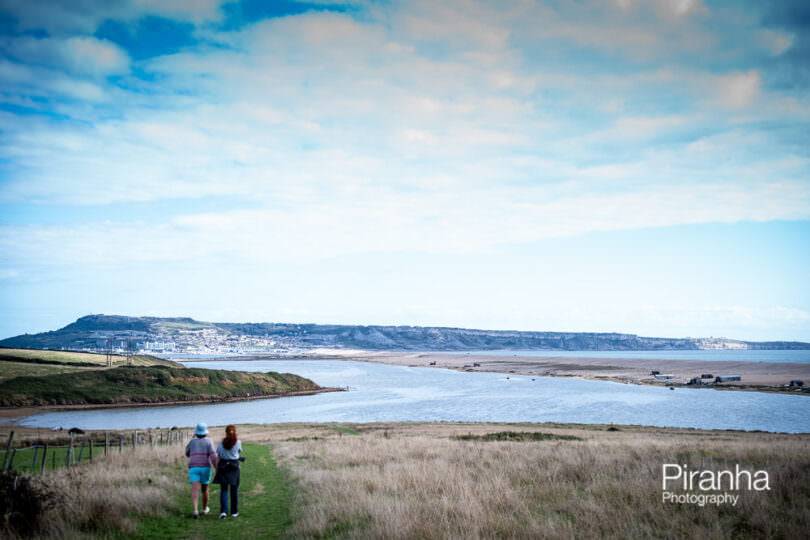 A view across Chesil Beach to Portland and Weymouth photographed this summer