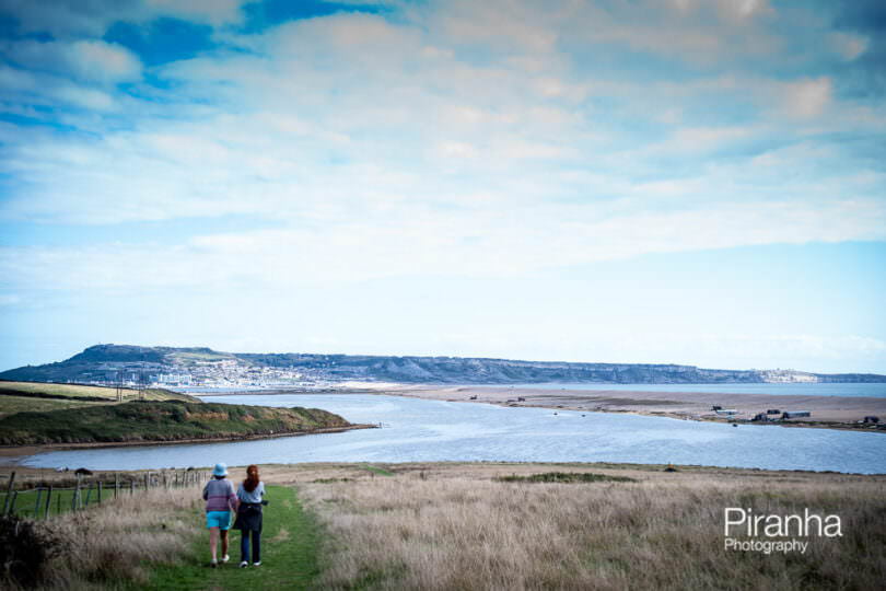A view across Chesil Beach to Portland and Weymouth photographed this summer