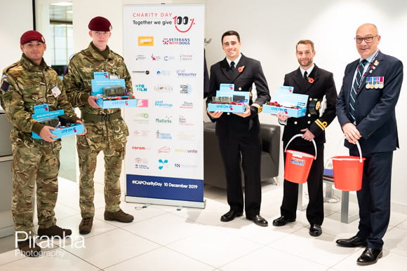 Collecting for poppy appeal in City of London in 2019 at company offices