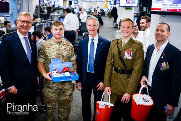 Service men collecting for poppy appeal in London company's offices