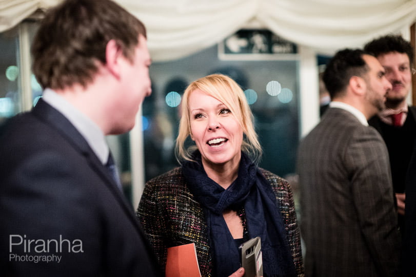 Guest photographed in conversation at evening event in London