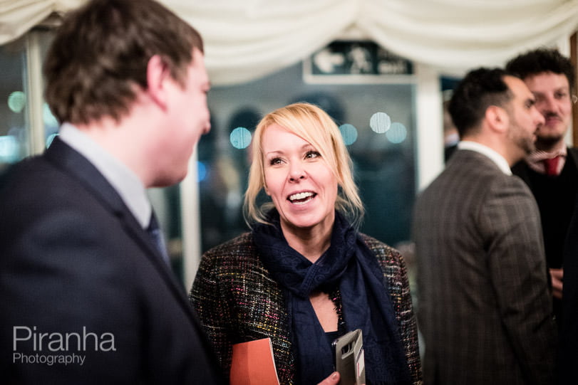 Event Photographer London – 5 Top Tips for Successful Event Photography 10 Guest photographed in conversation at evening event in London