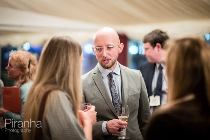 Event photographer London picture of guests photographed in conversation during London party at Houses of Parliament