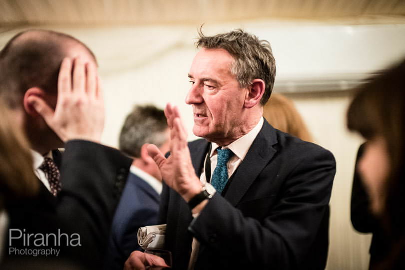 Politician photographed in conversation at party at Houses of Parliament by event photographer London