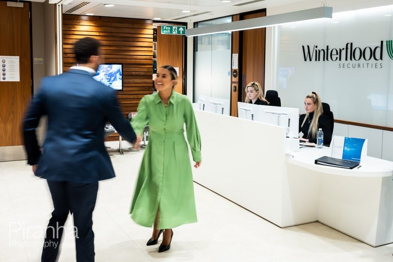 New photographs of two employees meeting at their London offices.