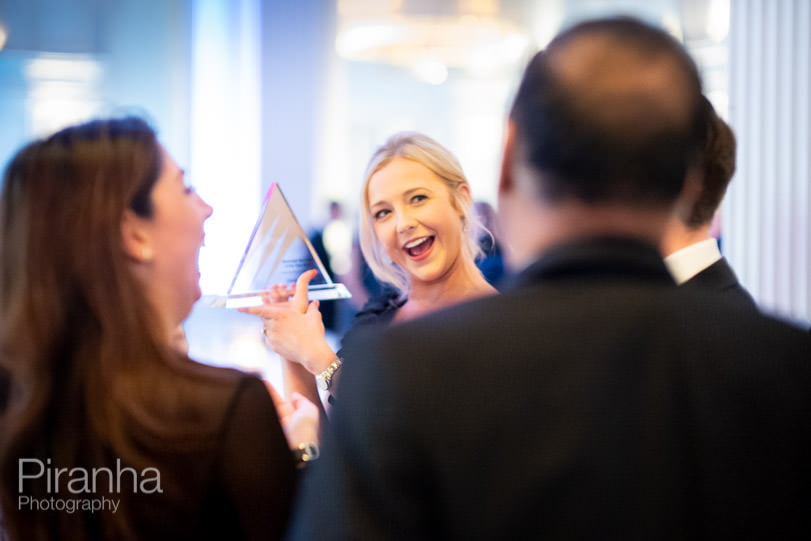 Evening award ceremony photography in London - award winner talking to other guests