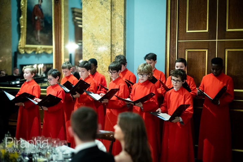 Photography of evening event at Fishmongers' Hall in London 6 choir of choristers singing at evening event in London