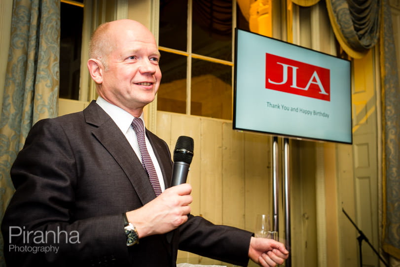 William Hague photographed speaking at evening event.