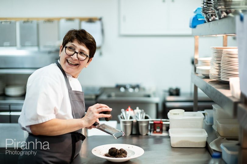 Chef photographed working in kitchens of London venue.