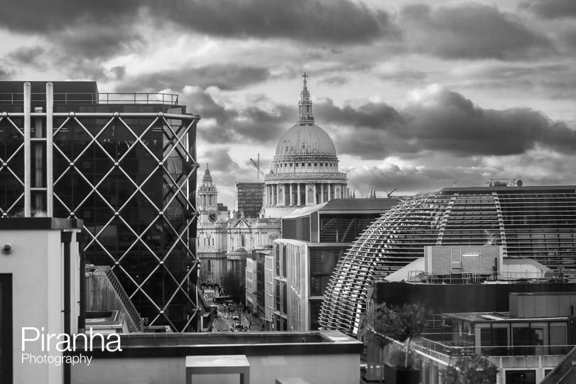 London skyline photograph in black and white, featuring St Paul's Cathedral
