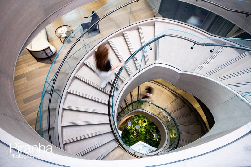 Working office photograph taken in London offices of staircase - action shot