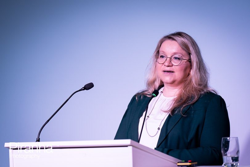 Presenter photographed during corporate event in London