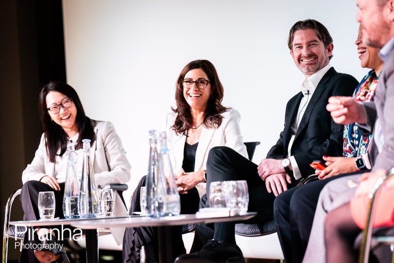 Panel of presenters photographed during corporate event in London