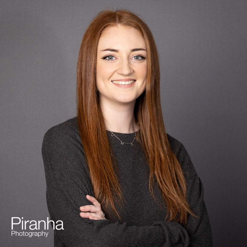 Headshot photographer in London - portrait against grey backdrop