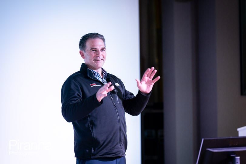 Presenter photographed during corporate breakfast meeting event in London