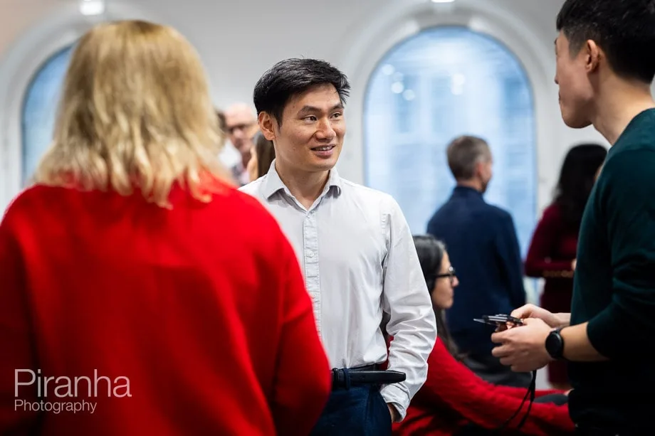 Company conference photographed in London offices.
