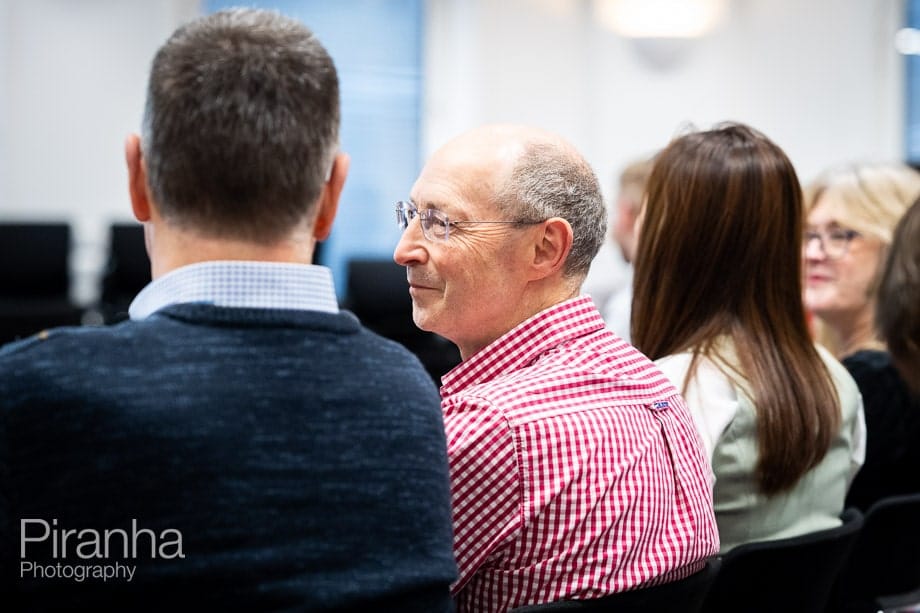 Company conference photographed in London offices.