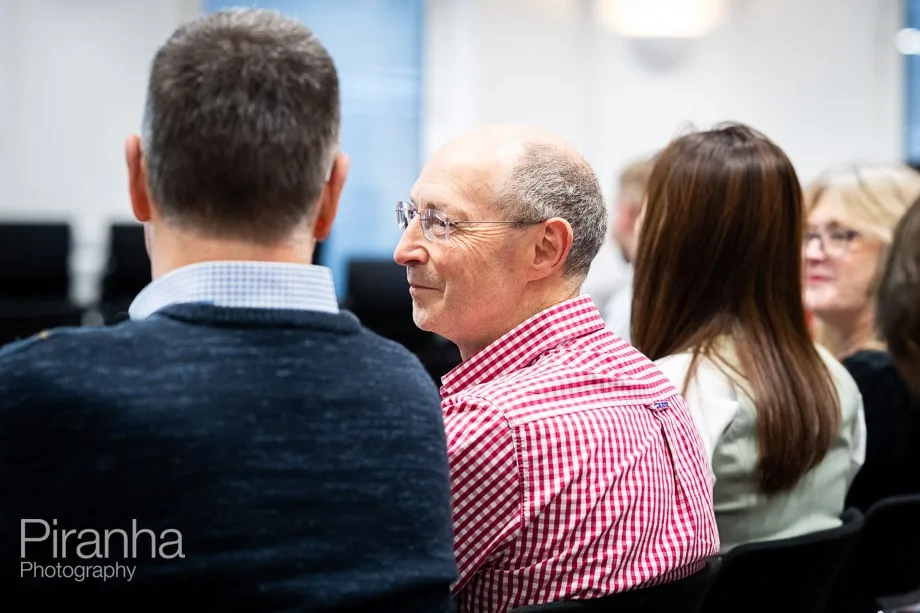Company conference photographed in London offices.