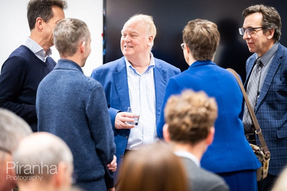 Company conference photographed in London offices.