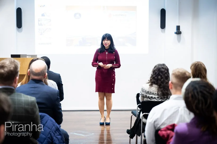 Company conference photographed in London offices.