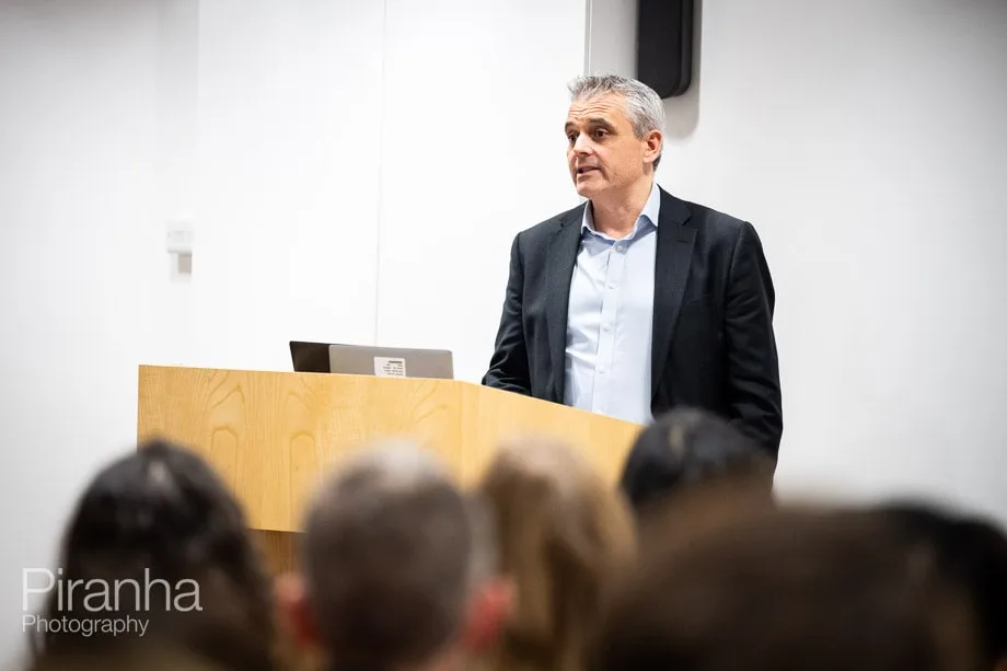 Company conference photographed in London offices.