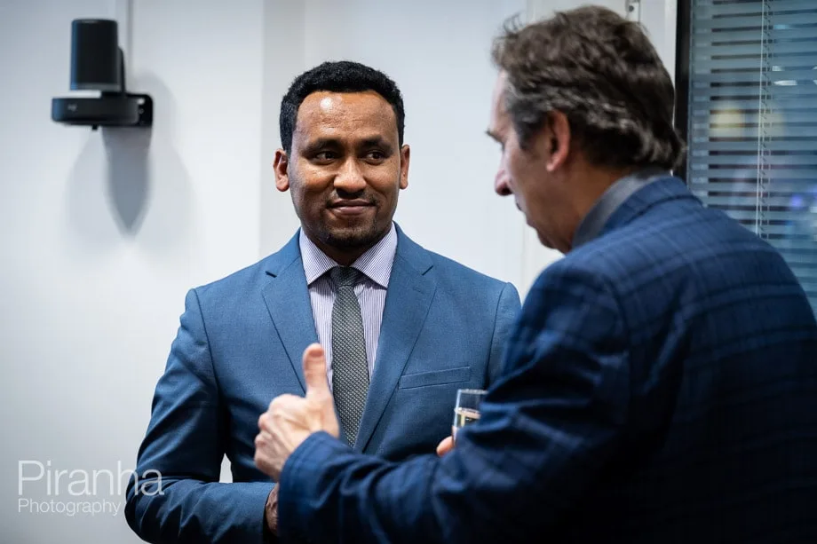 Company conference photographed in London offices.