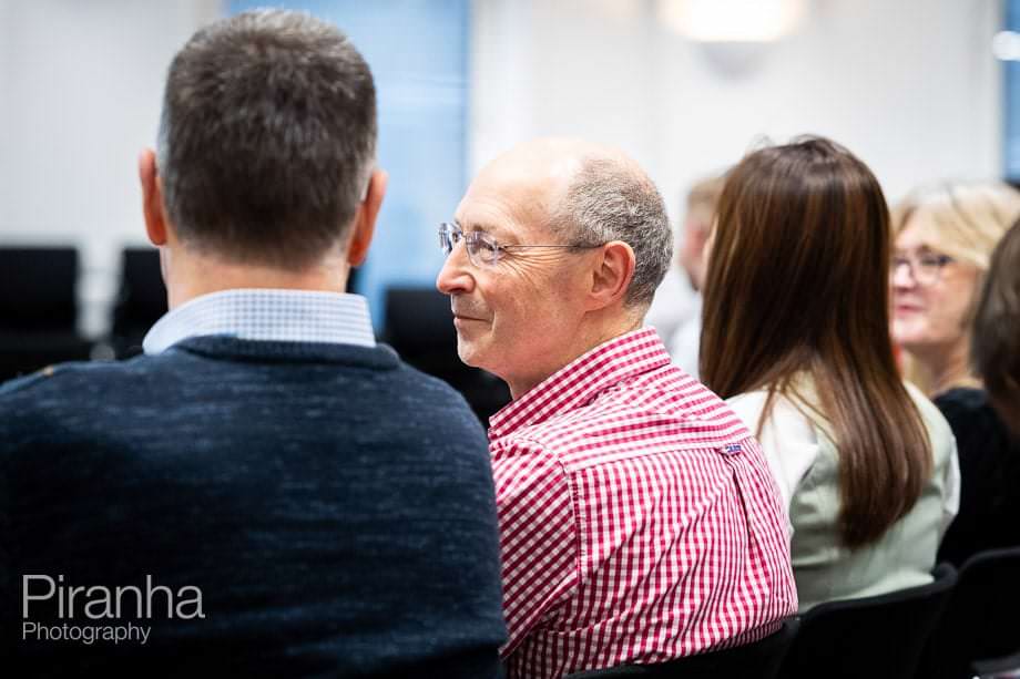 Company conference photographed in London offices.