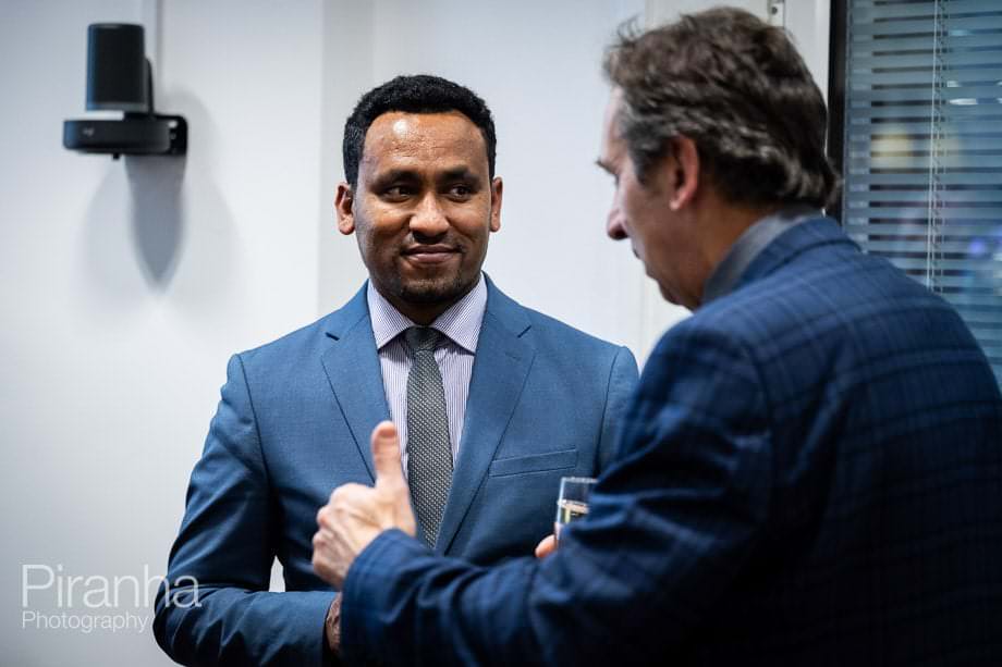 Company conference photographed in London offices.