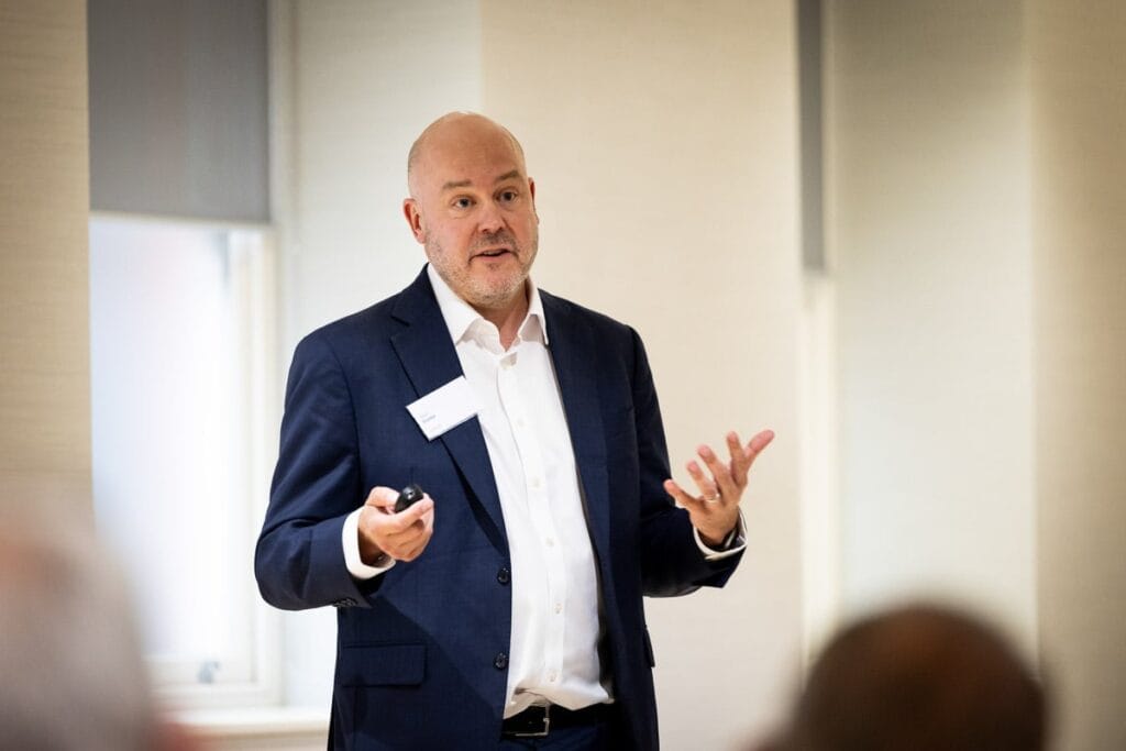 photograph of speaker at London conference