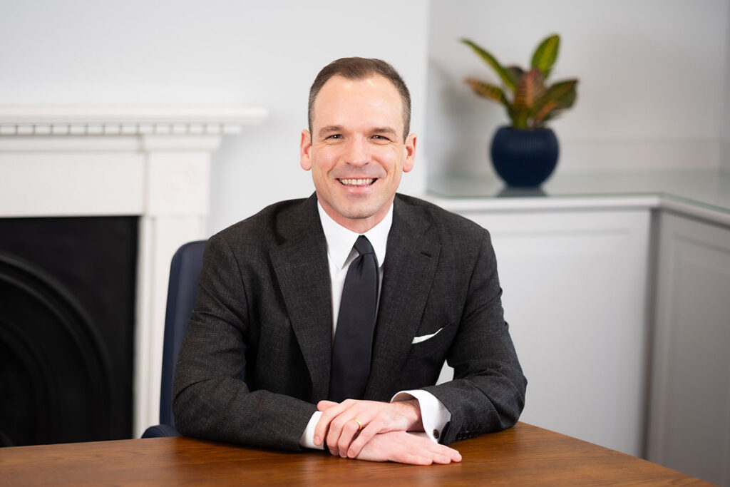 Why does the camera unsettle some people and not others? 2 Portrait photograph of barrister taken in London offices.