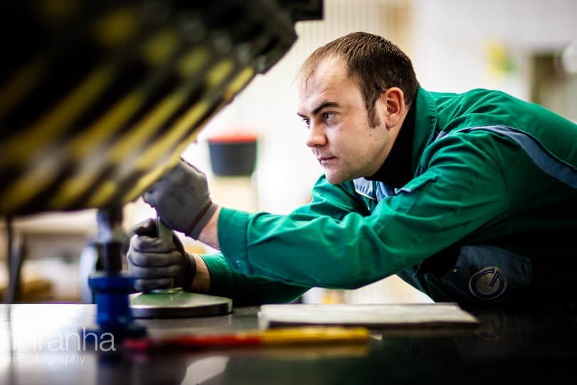 Factory worker photographed in Germany for private equity client.