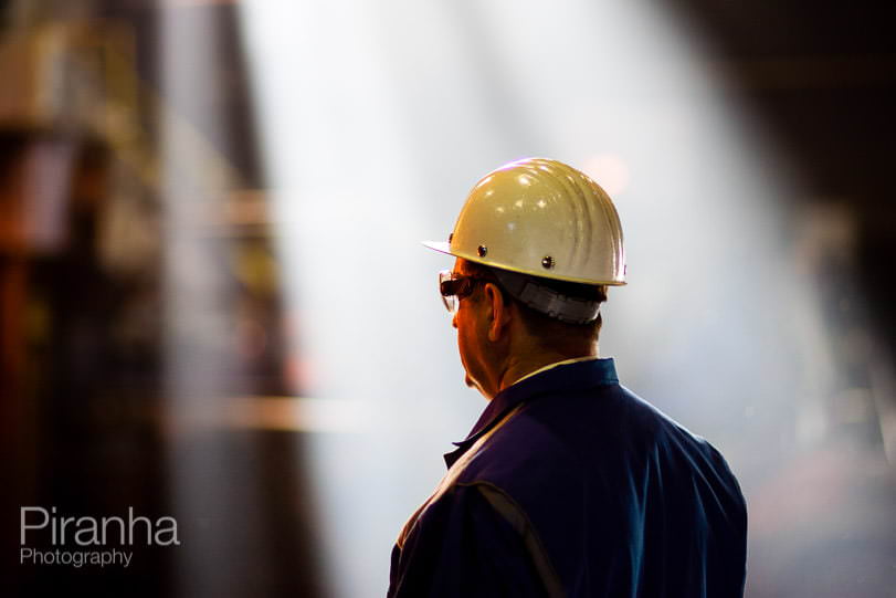 Factory worker photographed in Germany for private equity client.