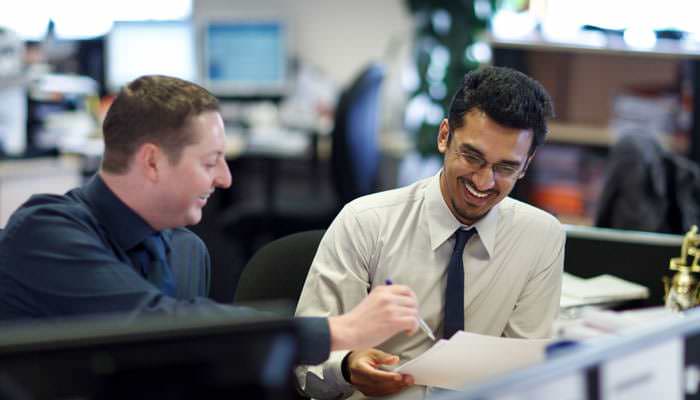 Office Photograph of Members of Staff Working