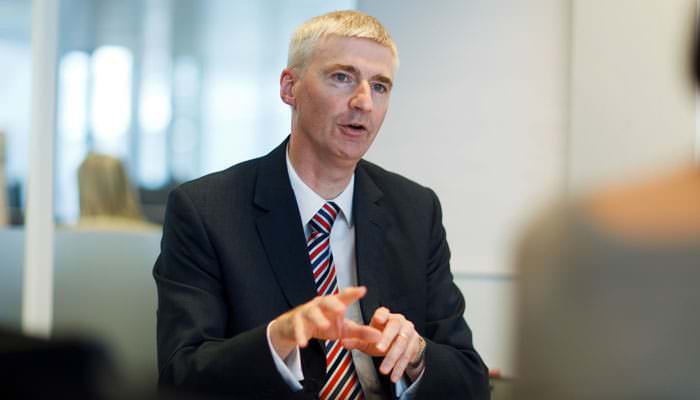 Photograph of Staff Member in Meeting for Company Report