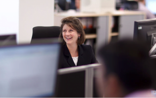 Photograph of employee workin in office environment for Bank's annual report