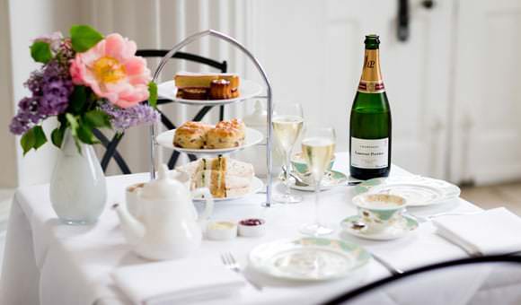 Photograph at Royal Historic Palace for new brochure - guests having champagne in restaurant