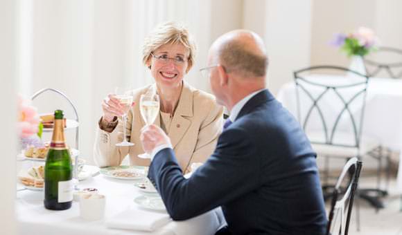 Photograph at Royal Historic Palace for new brochure - guests having champagne in restaurant