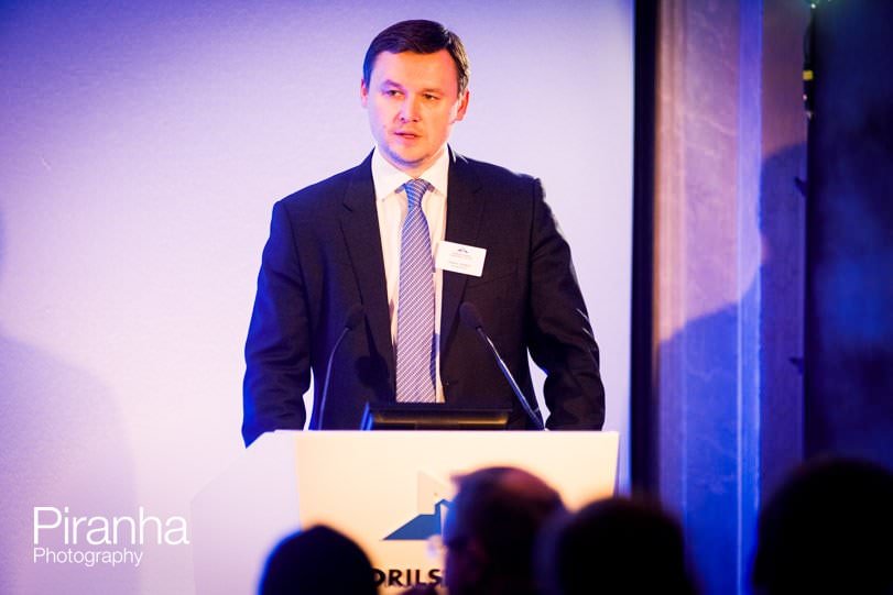 Photography of speaker during capital markets day in London