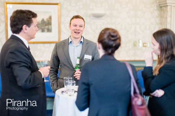 Guests discussing at law event in London photographed by Piranha
