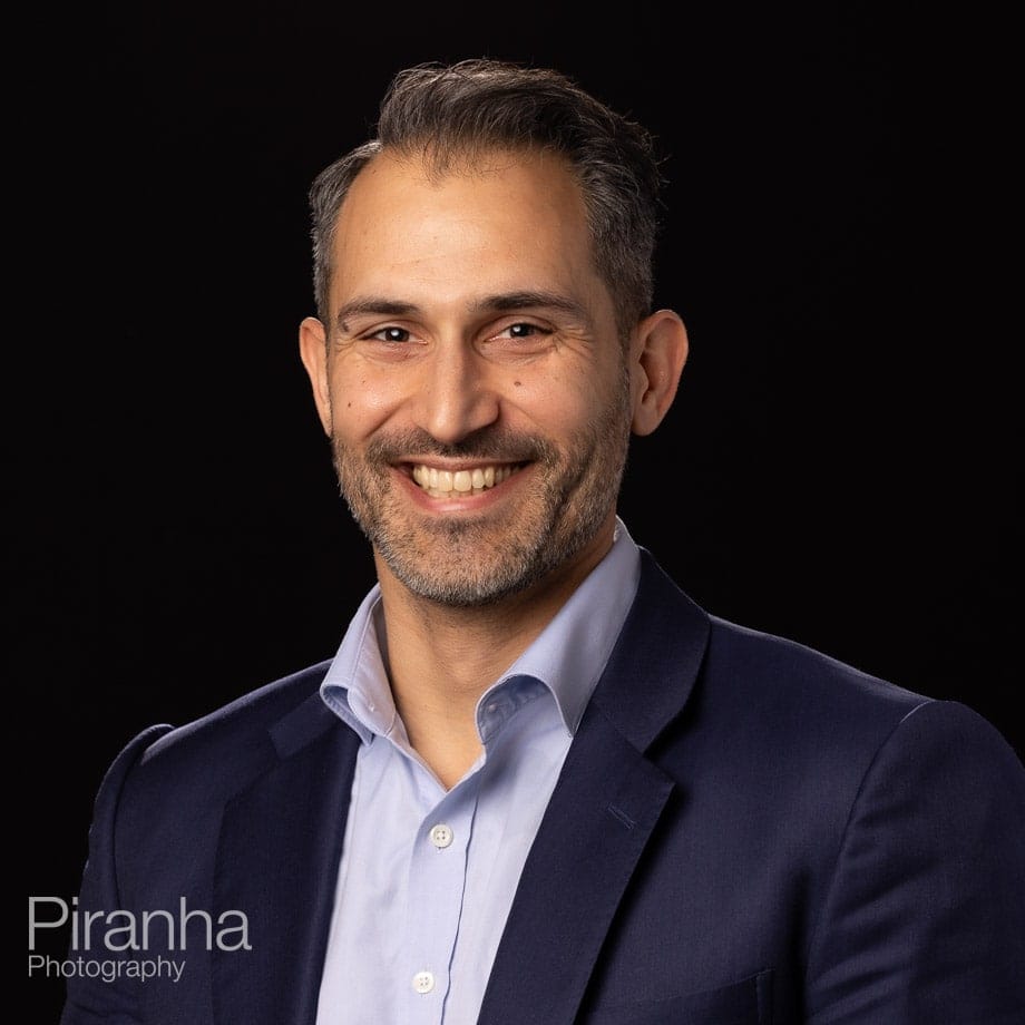 Headshots taken against a black background back drop.