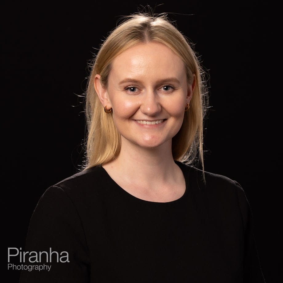 Headshots taken against a black background back drop.