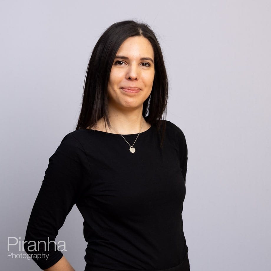 Headshots against white backdrop.