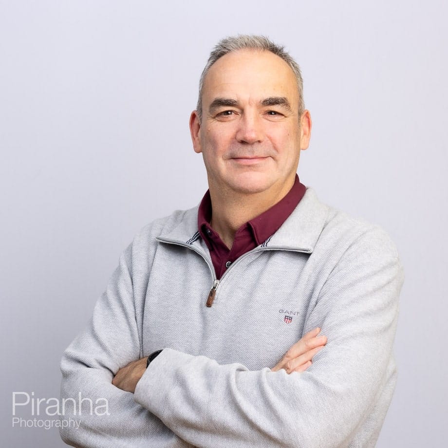 Headshots against white backdrop.
