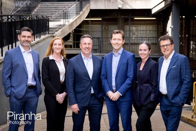 Business group shot taken in London at outdoor location.