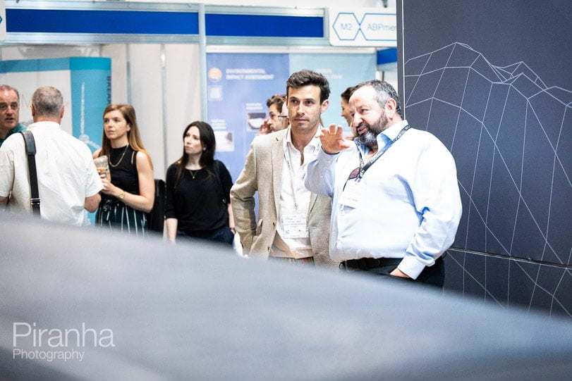 Exhibition stand photographer at Excel exhibition centre in London - guests visiting the stand