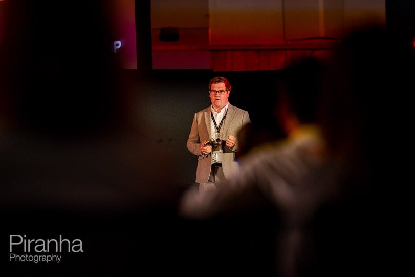 Event photography in London of speaker at AGM event where Piranha took photography and video for company