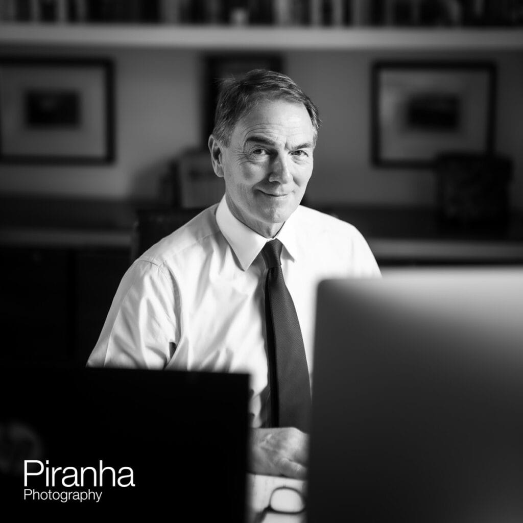 Reportage photograph taken of working Director for business.